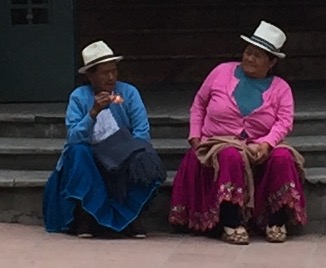 Two local women wearing their ever-popular Panama hats, which are actually made in Cuenca, Ecuador!
