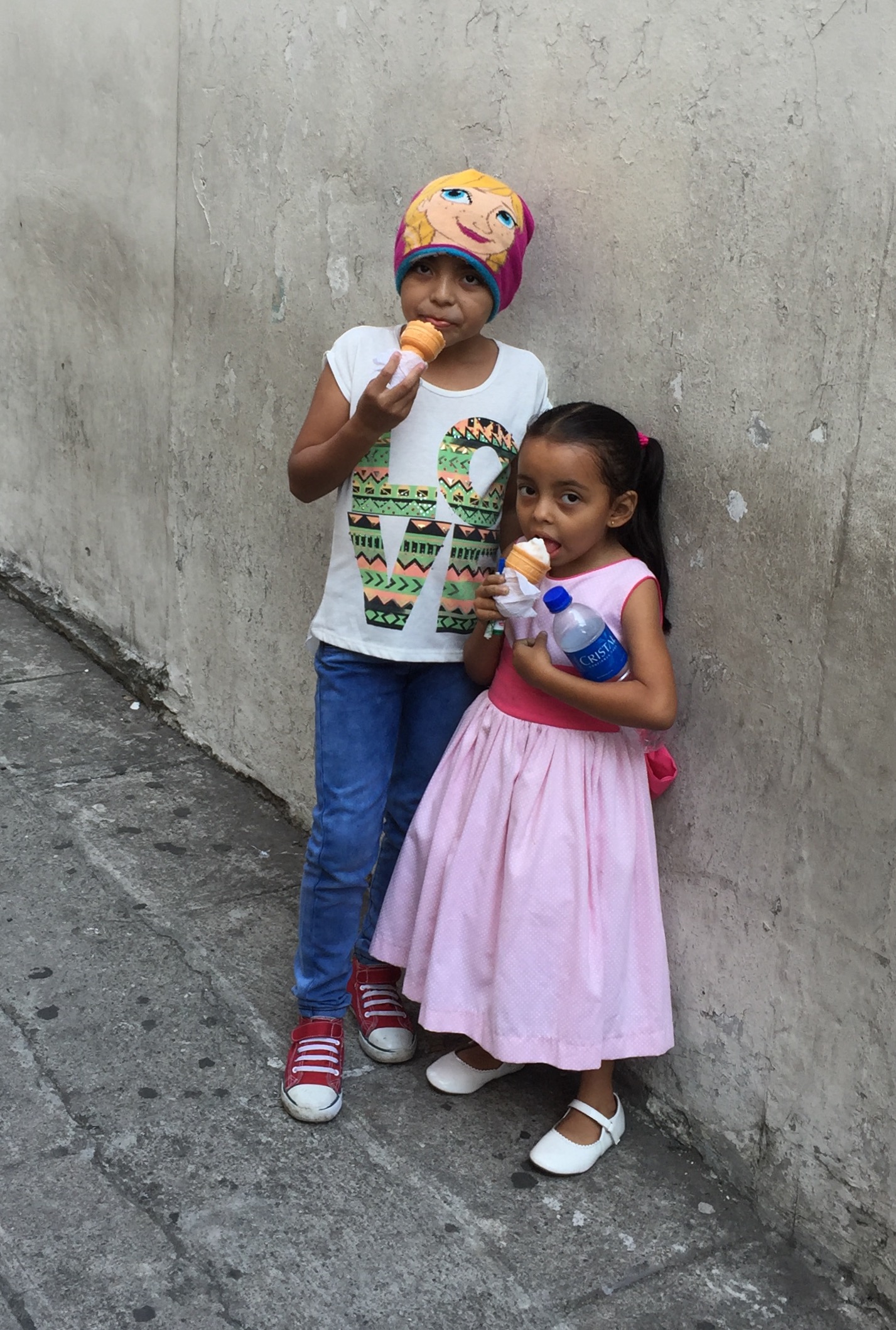 Children enjoying ice cream outside of San Salvador Cathedral.