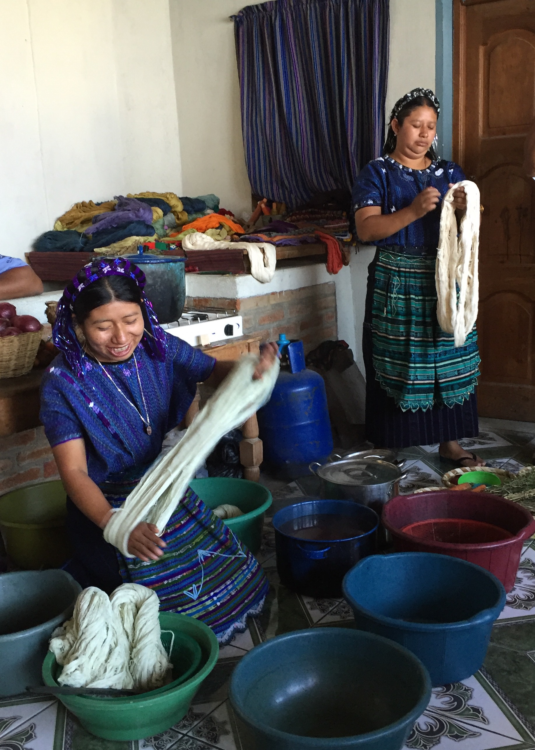 Women of the textile co-op at San Antonio Palopo, shown here using natural dyes to color the cotton before it is woven.