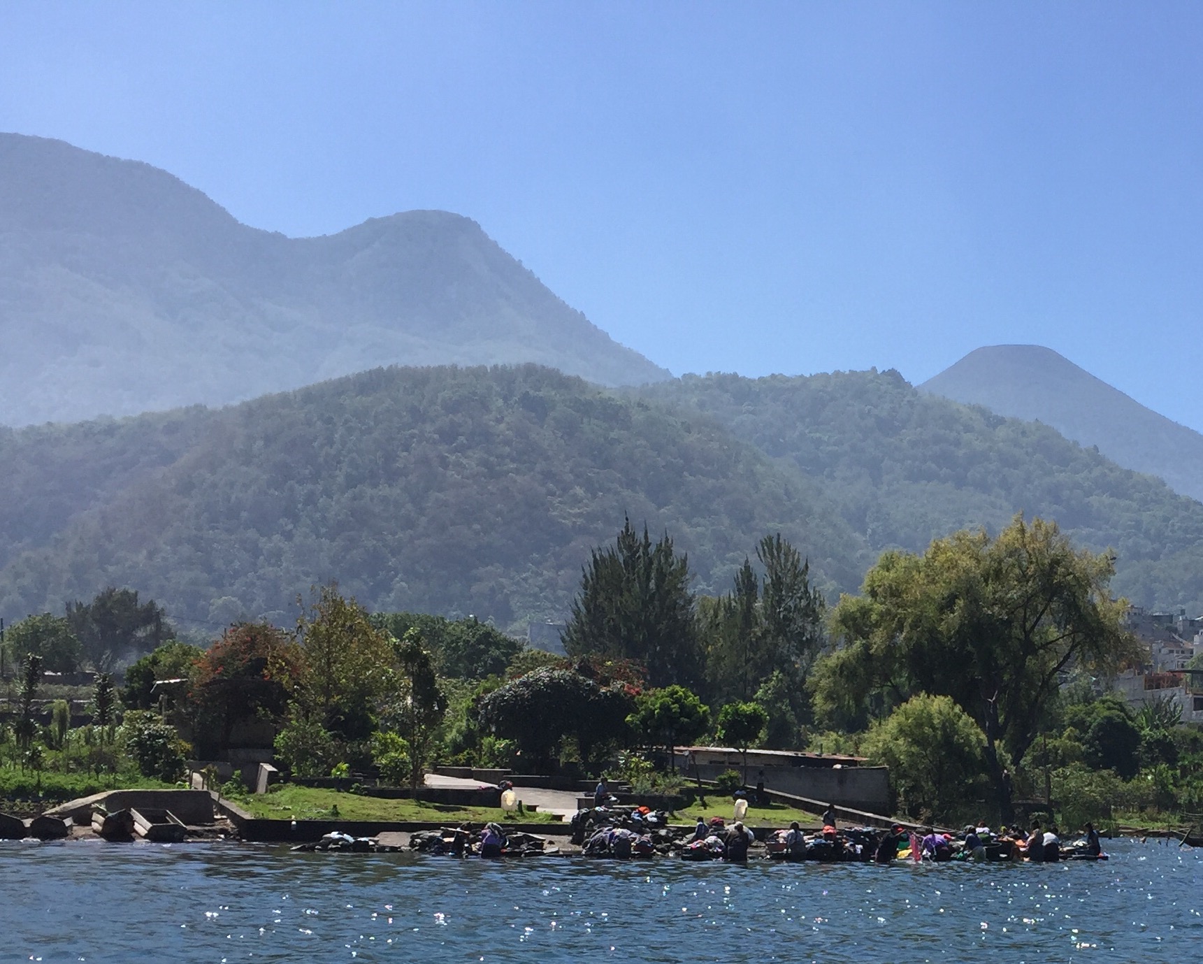Cruising past a throng of women doing laundry on the side of Lake Atitlan.