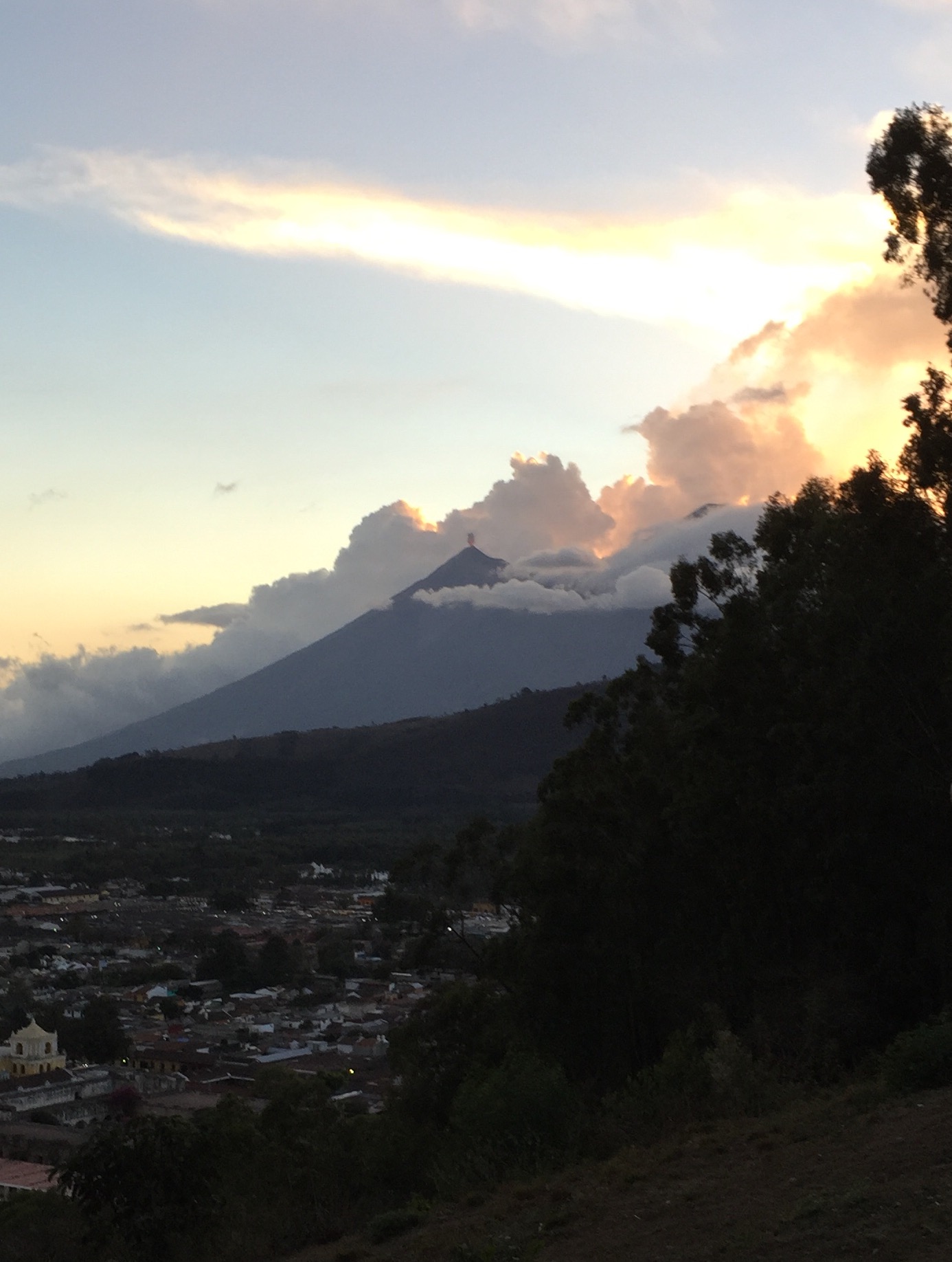 View from the Cerro de la Cruz above Antigua, as Volcán de Aguain erupts just after sunset.