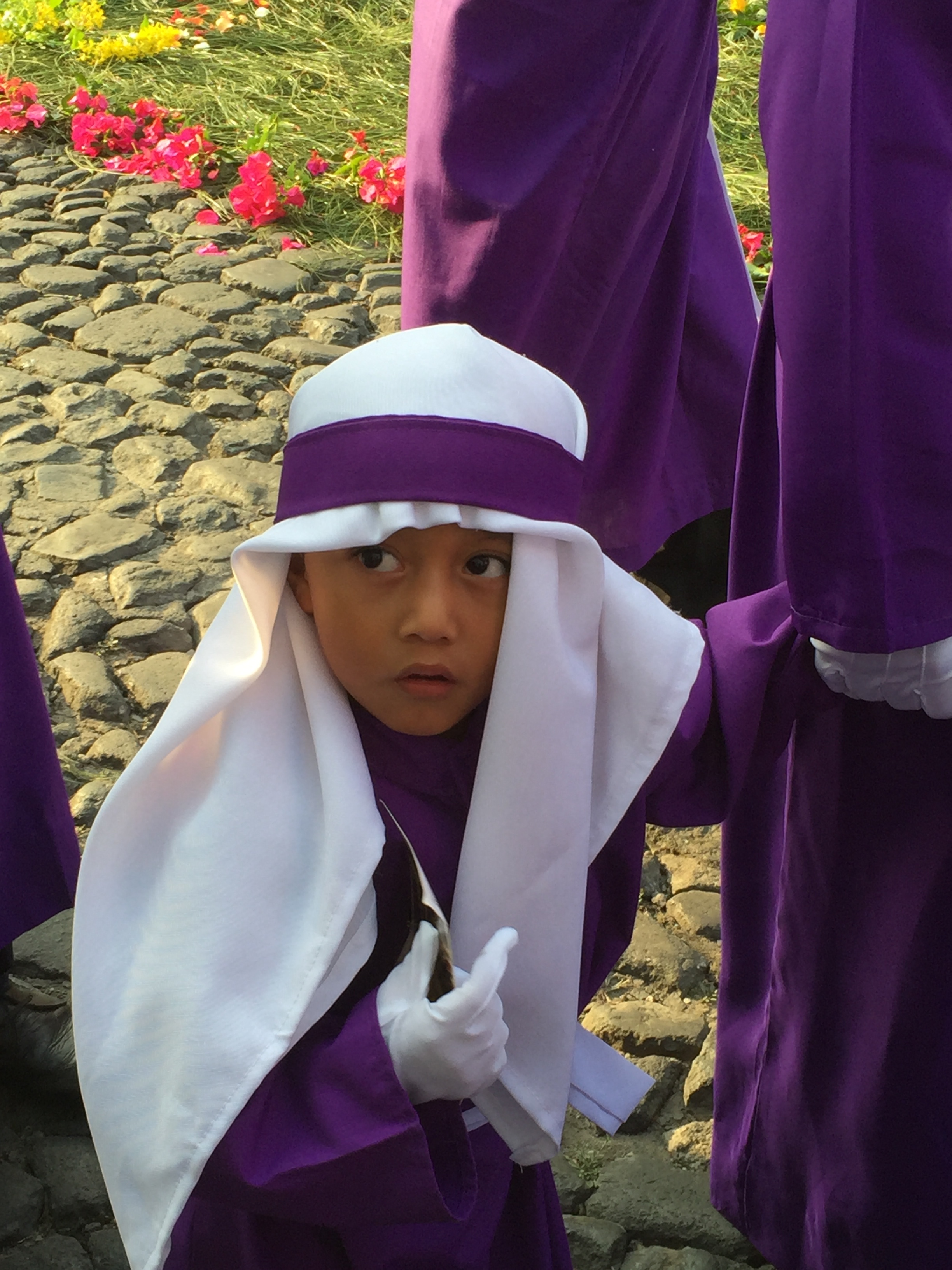 Young participant in the Semana Santa procession, Antigua, Guatemala.