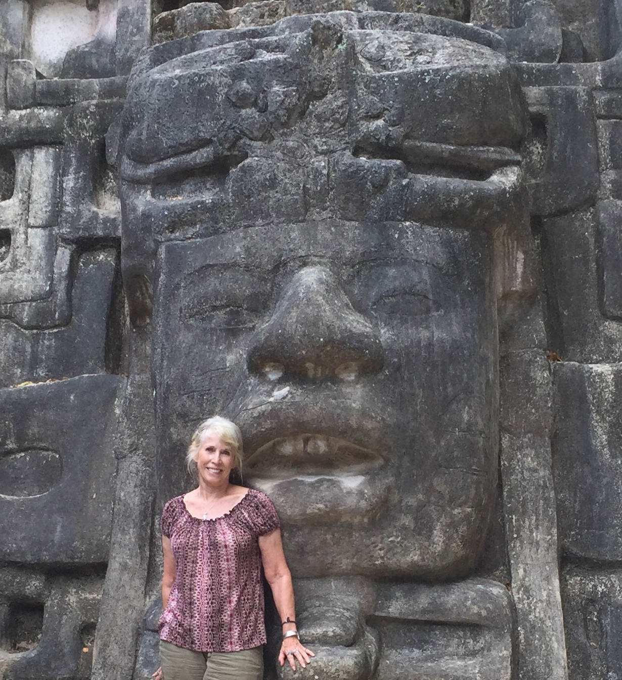 That's me in front of a massive stone carving at Laminai in Belize. Only a small fraction of the buildings of this site have been excavated.