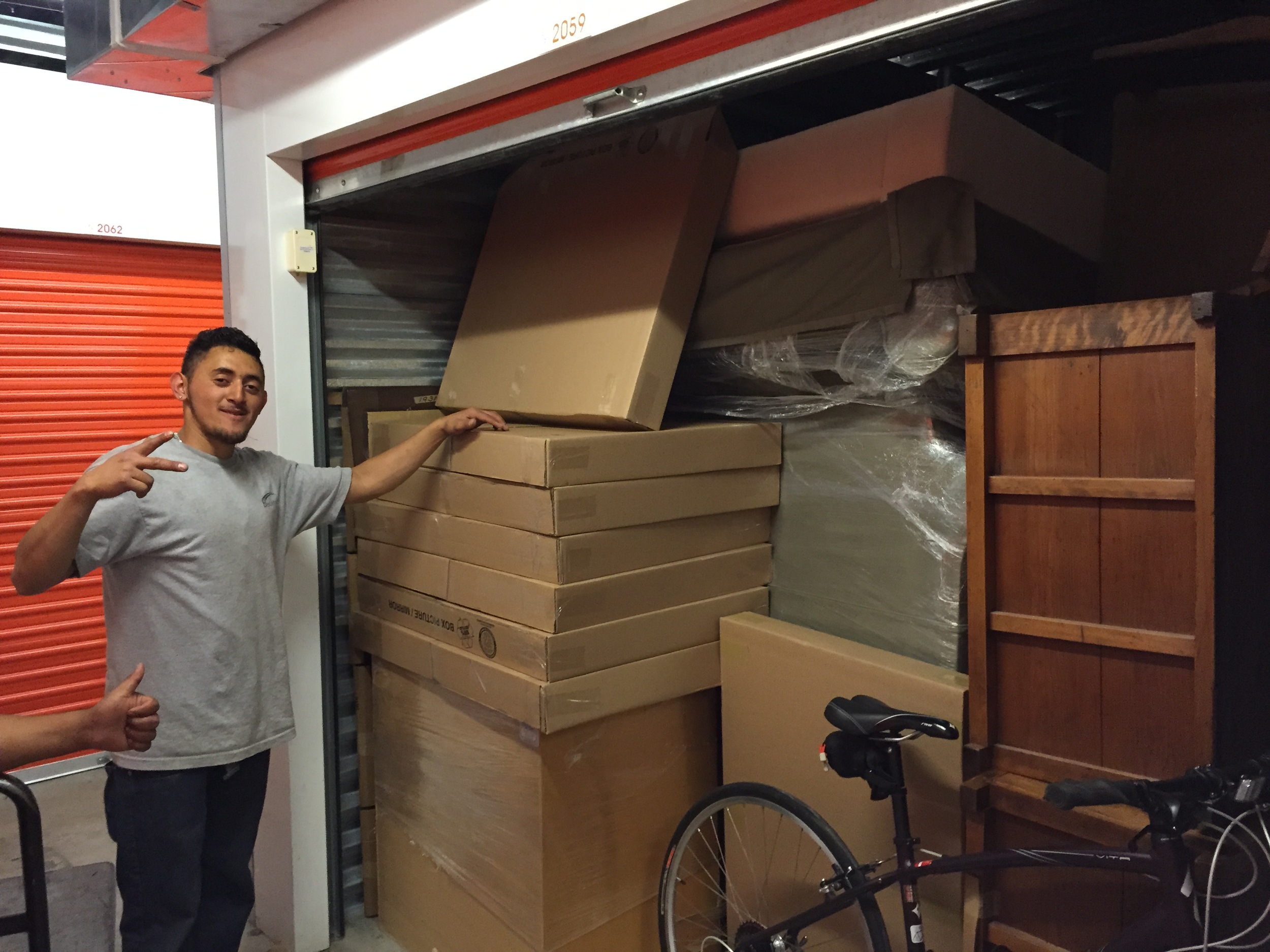 Above, one of the movers gets ready to close the door on my 10' x 15' storage unit. I was really glad that my road bike fit into the space!
