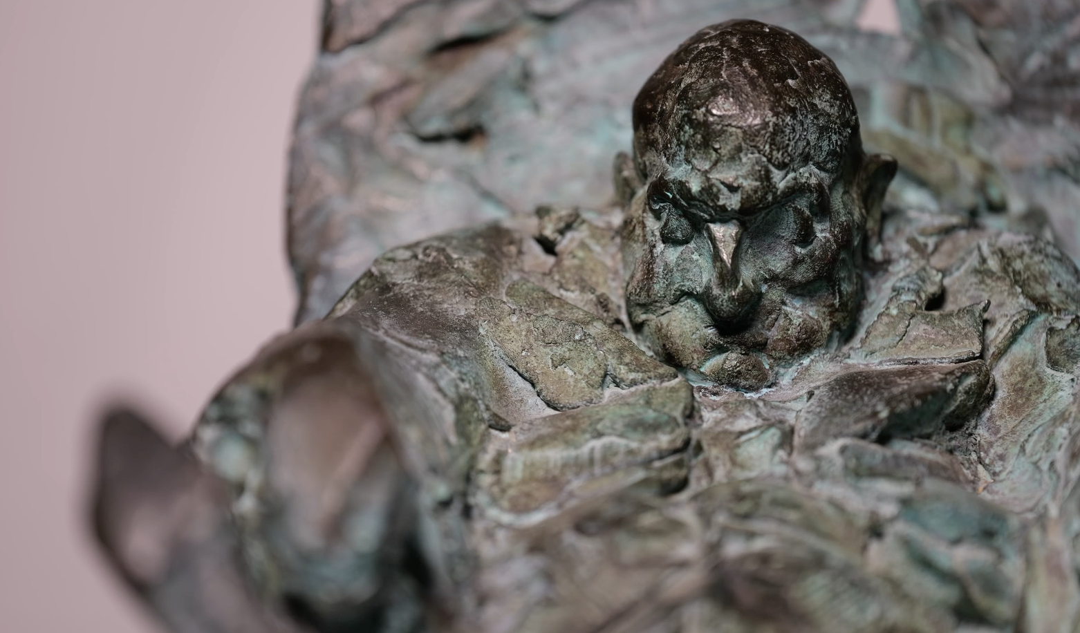 Simon Kogan bronze figurative sculpture of Johann Sebastian Bach reading a book in a contemplative pose