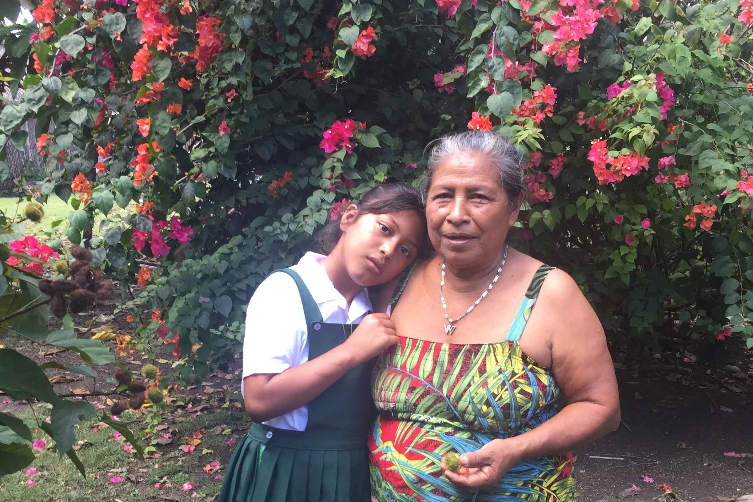 Josefa (R) had to leave school after third grade to help her widowed mother. She hopes that her granddaughter, Kathia (L), who is now in elementary school, will have more access to education than she did.