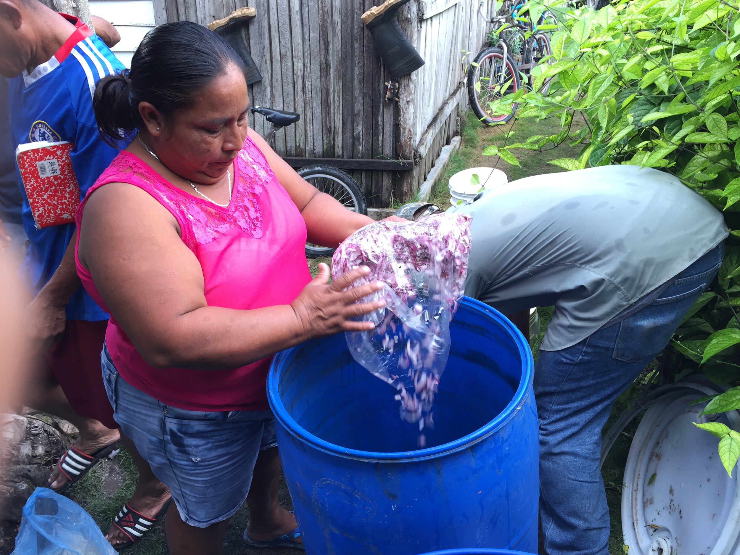 Maria Santos helping to combine the materials for the M5 (insecticide).jpg