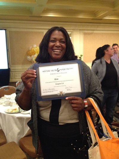 Kim proudly shows us her "Celebrating Success" certificate!