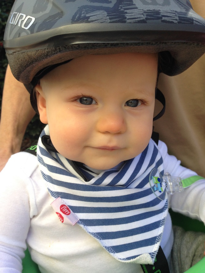 We bought a bike carrier and helmet for you little one! You cried the first time we tried your helmet on, but loved riding around the neighborhood on dad's bike. You squealed every time that I sped past and babbled about the entire ride.