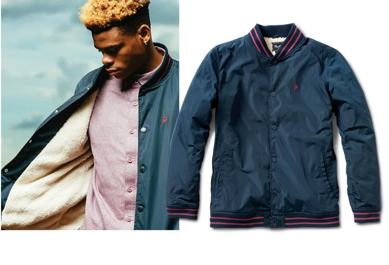  PRIMITIVE® SHERPA VARSITY - Poly shell baseball bomber with cozy sherpa lining throughout. Striped varsity rib.&nbsp;(shown in Navy) [o] Oliver Barton 