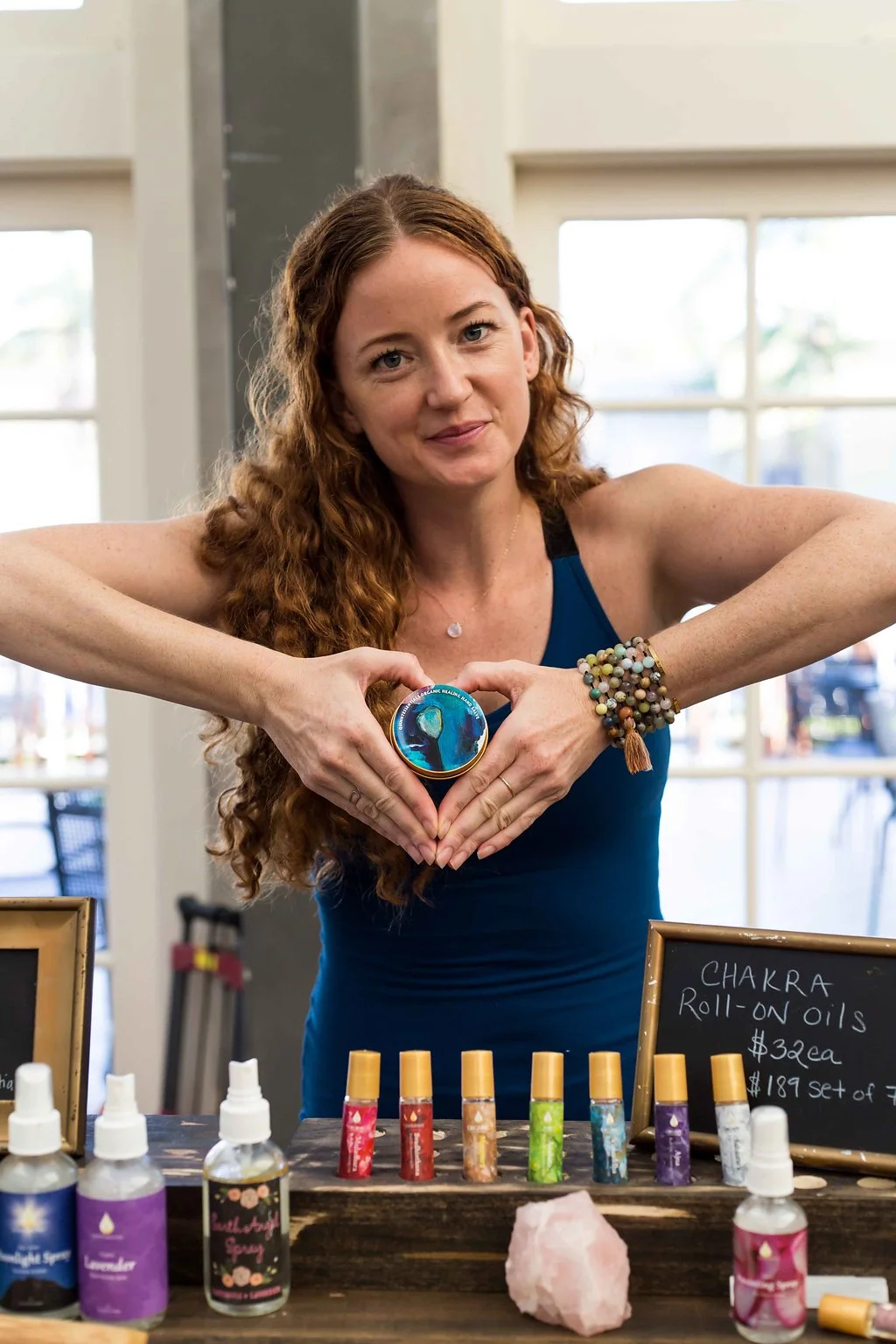This healing hand salve was a vision of artist Angela Harken of Harken Creative. She needed a healing salve for her dry painter hands. We used one of her paintings for the label.