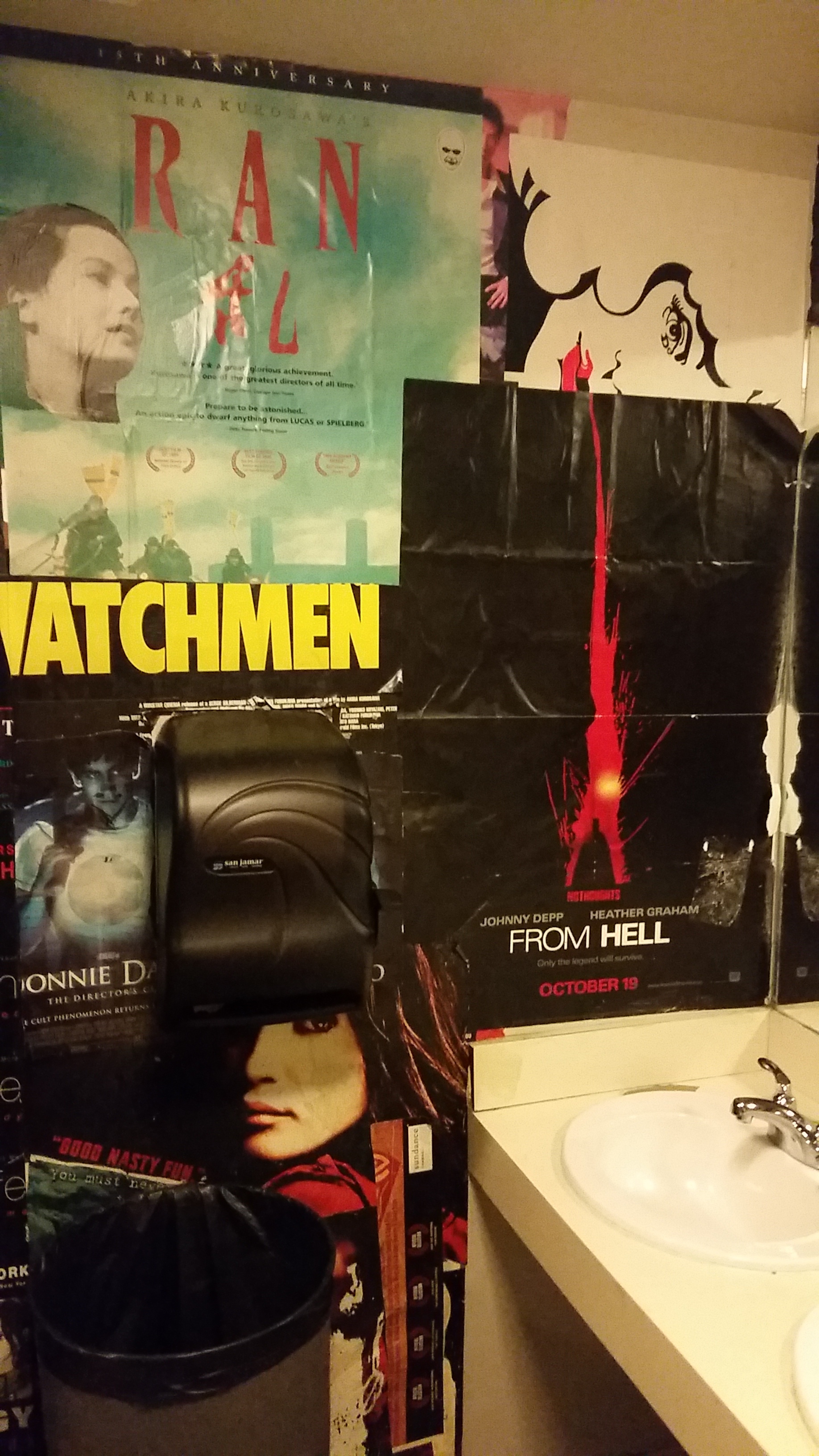 Posters line the restroom walls.
