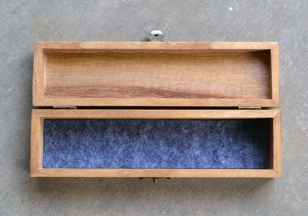 aerial view open dice tray charcoal felt