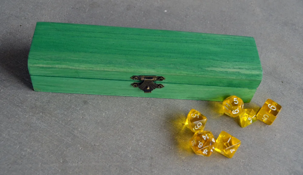 Green chest closed dice.jpg