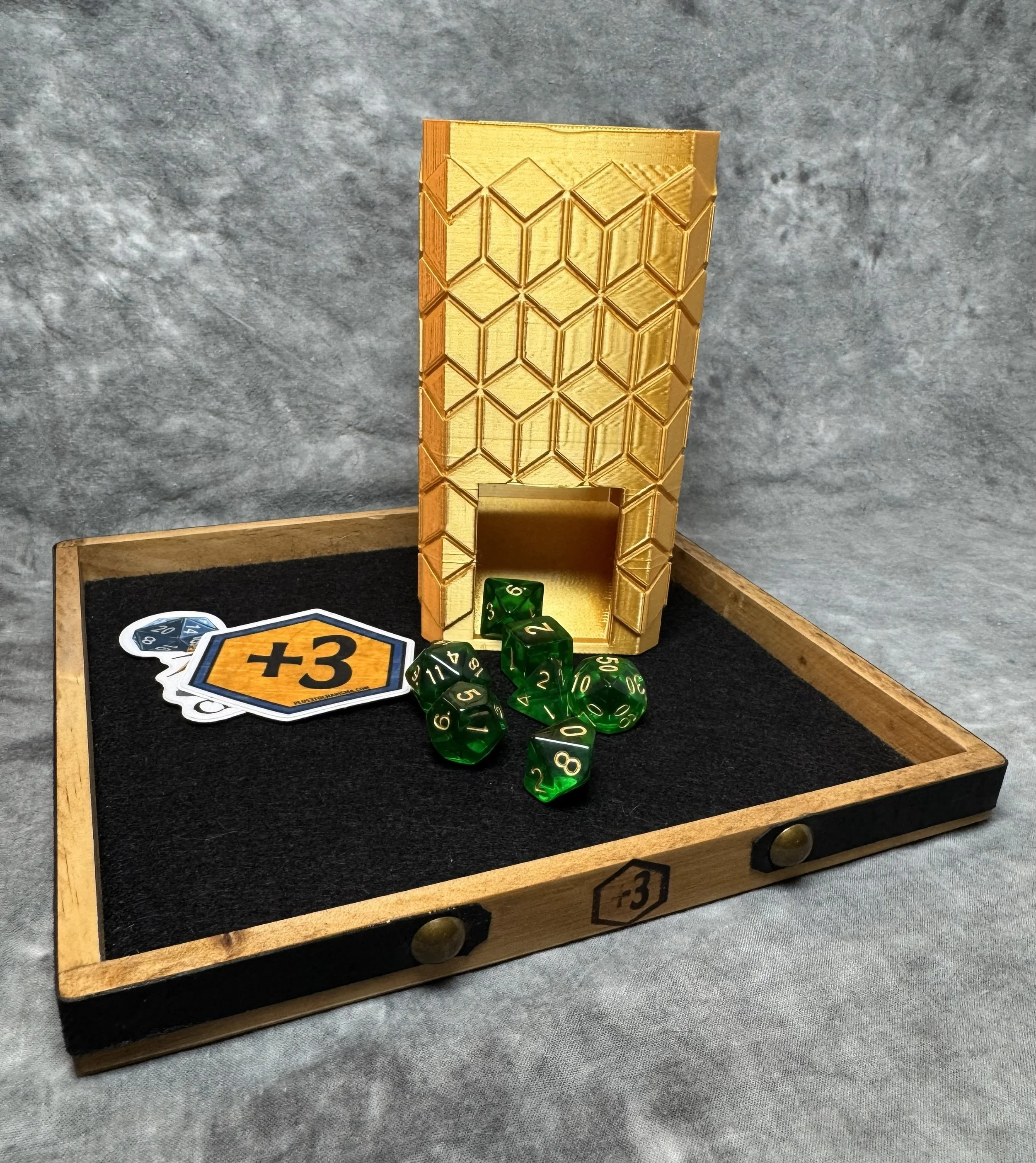 Custom wood dice tray with leather accents and felt interior, paired with gold cube-design 3D printed dice tower. TTRPG starter set gift idea.