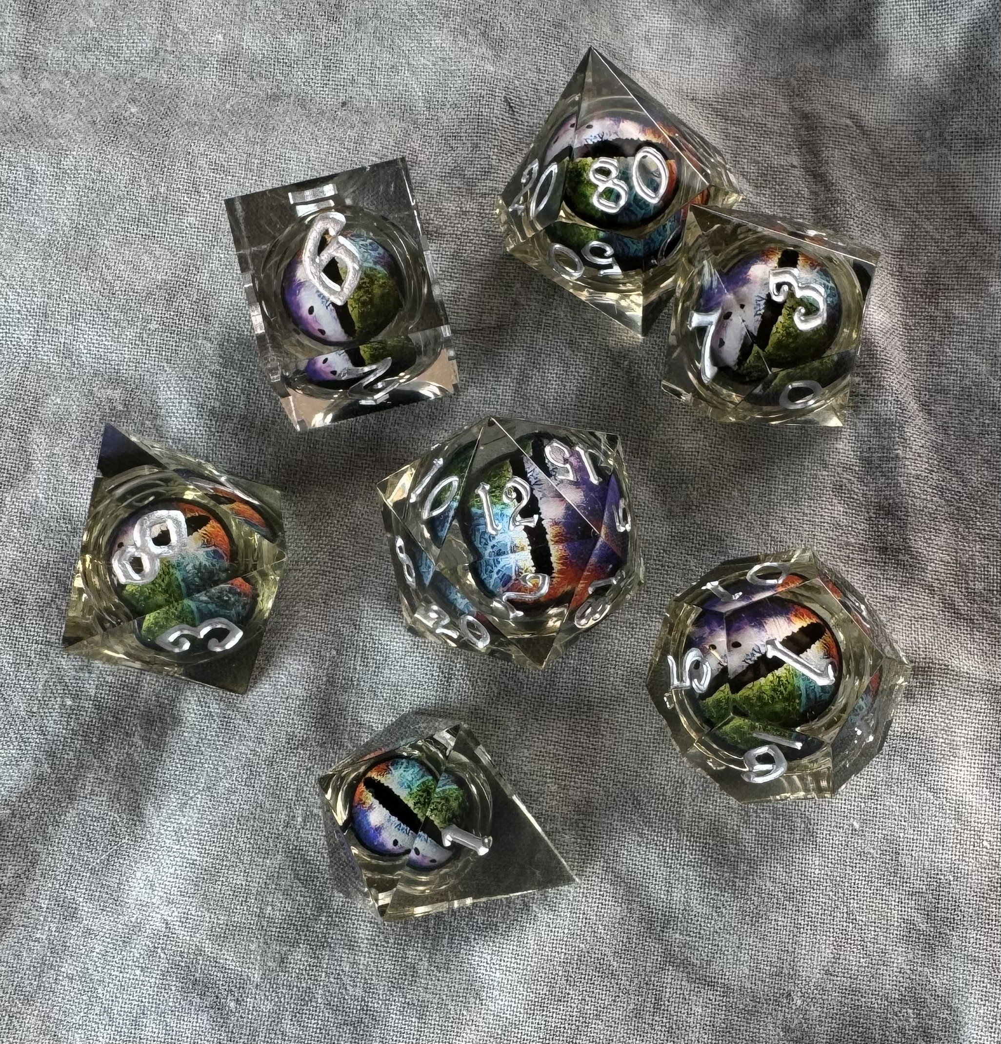 The Multicolor Eye of the Dragon Sharp Edge Dice Set | Rainbow Floating Core Clear Resin Dice | Polyhedral Dice for D&D/TTRPG