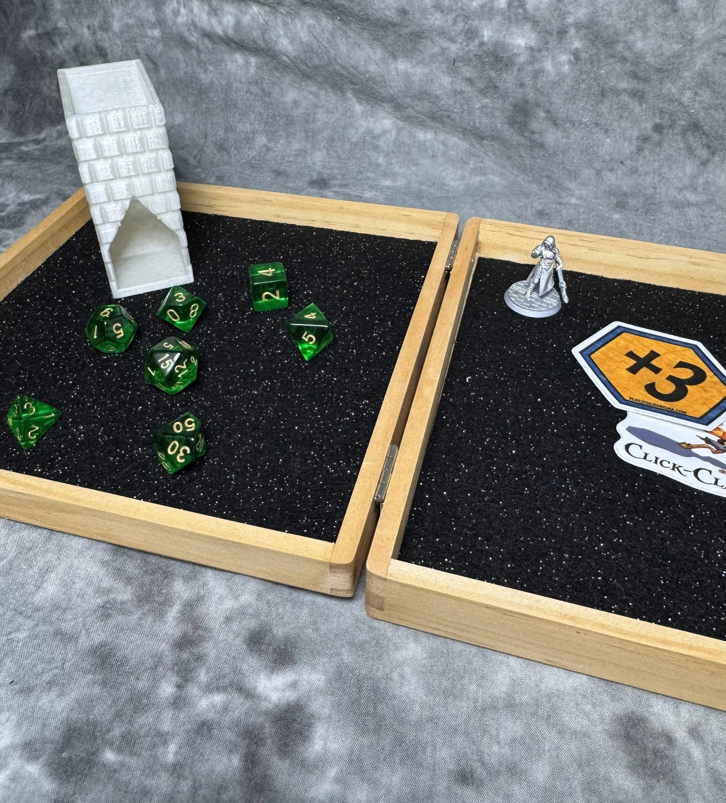 Double-sided wood dice tray that latches securely shut, shown with a compact 3D printed dice tower for travel TTRPGs. Laying flat with minifig and dice