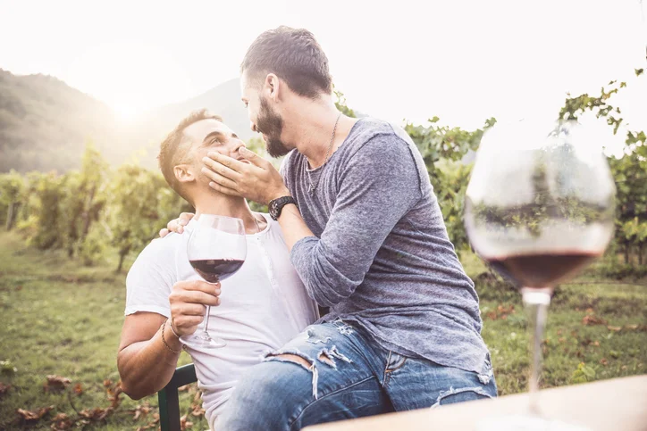 MaleCoupleSharingWine.jpg