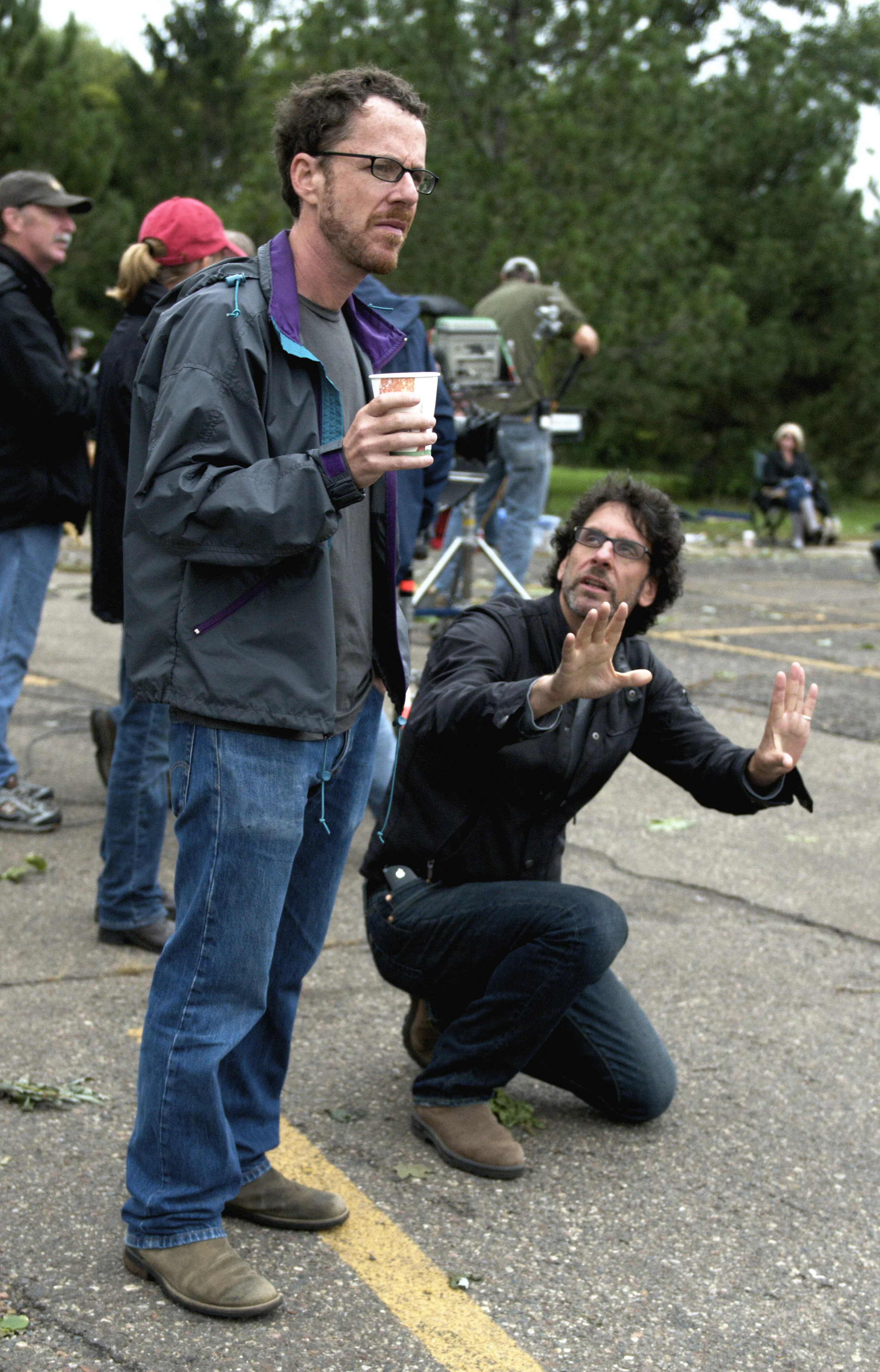 Directors Ethan and Joel Coen look for a shot on the set of A Serious Man (2009)