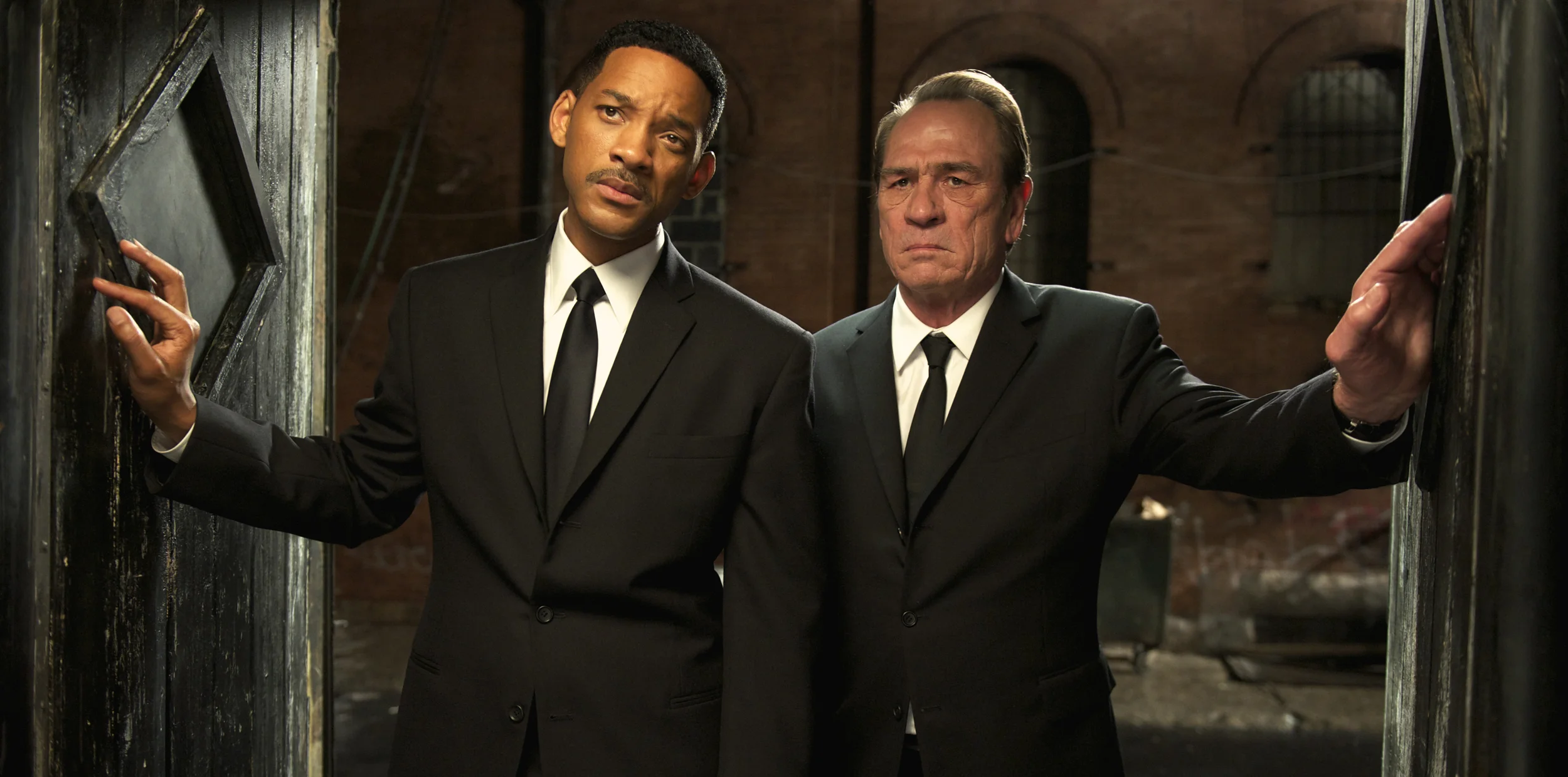 Will Smith as Agent J and Tommy Lee Jones as Agent K about to shakedown Wu and in Men in Black 3 (2012)