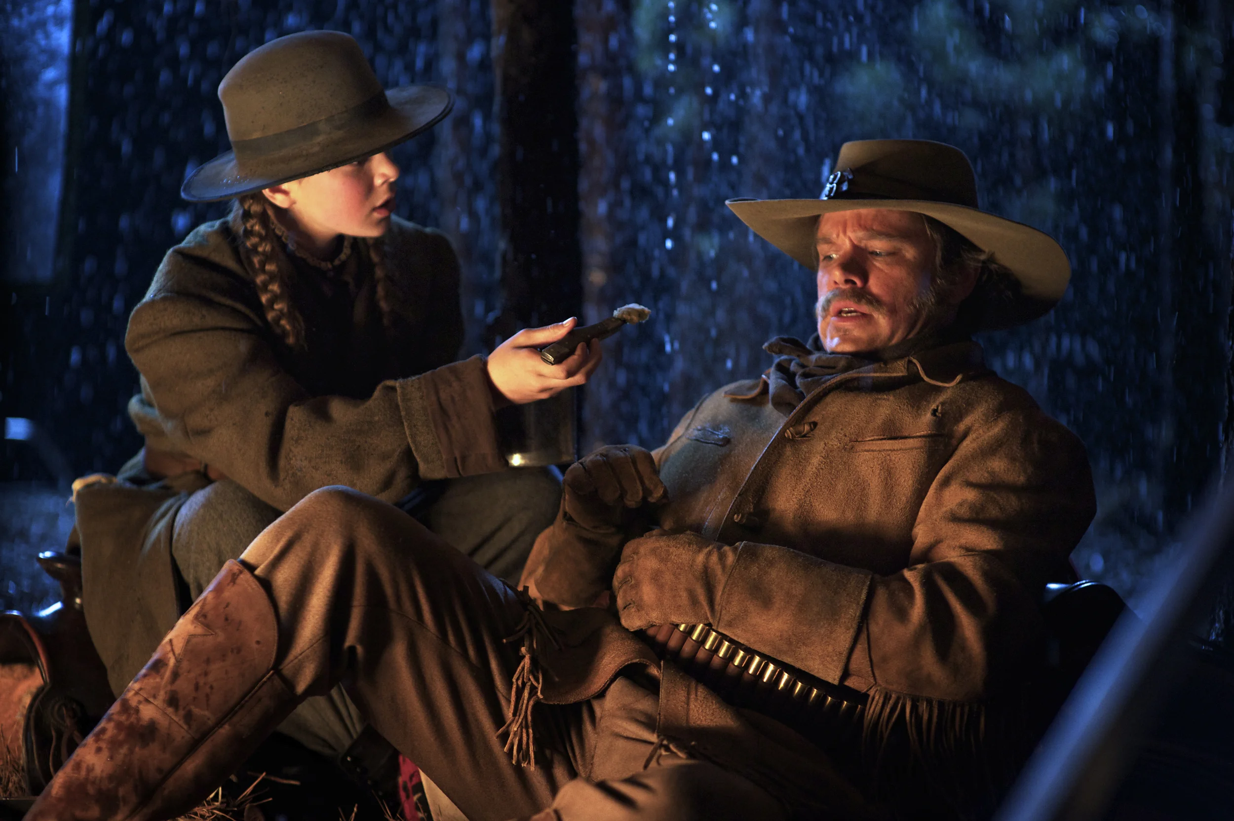 Hailee Steinfeld as Mattie Ross and Matt Damon as La Boeuf in True Grit (2010)