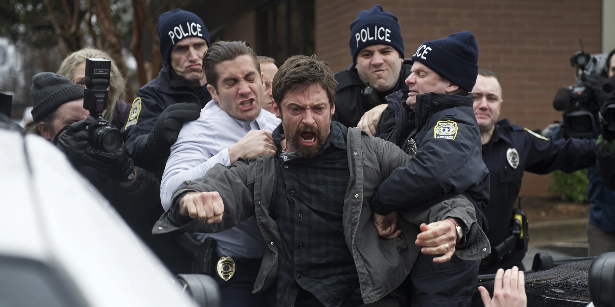 Jake Gyllenhaal as Detective Loki and Hugh Jackman as Keller Dover holding back the anger in Prisoners (2013)