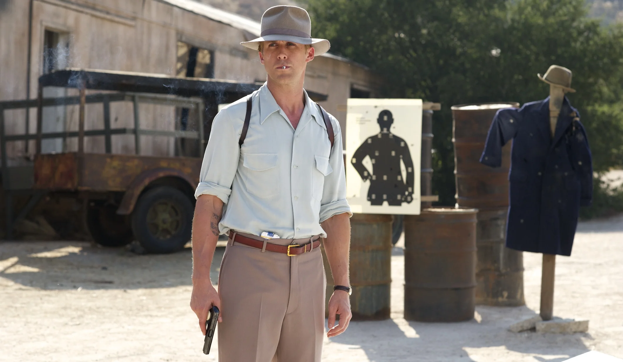 Ryan Gosling as Sgt. Jerry Wooters practices his aim in Gangster Squad (2013)