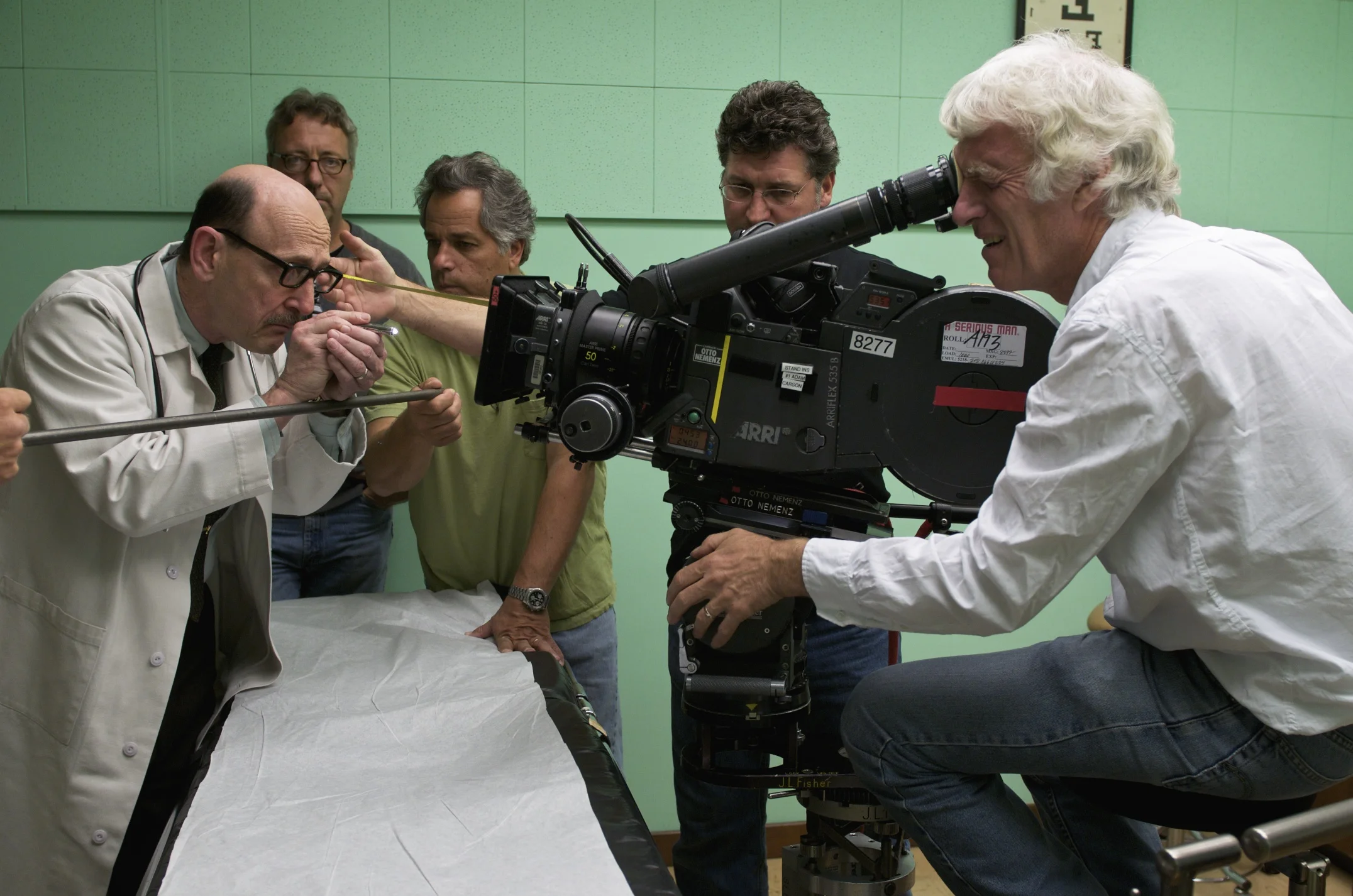 Raye Birk as Dr. Shapiro, Bill O'Leary, Mitch Lillian, Andy Harris, and DP Roger Deakins on the set of A Serious Man (2009)