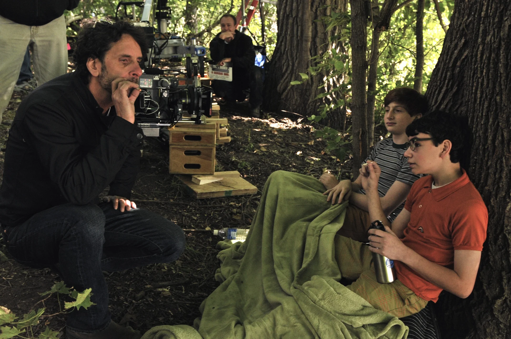Director and Writer Joel Coen with Aaron Wolff and Benjamin Portnoe smoking in the woods on the set of A Serious Man (2009)