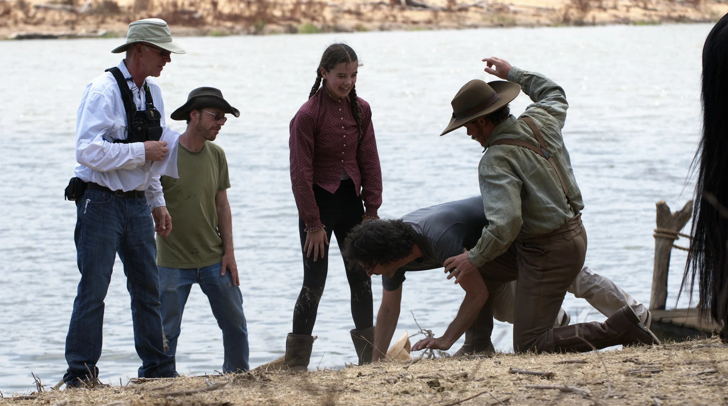 Directors Ethan and Joel Coen showing Hailee Steinfeld and Matt Damon how to spank on the set of True Grit (2010)