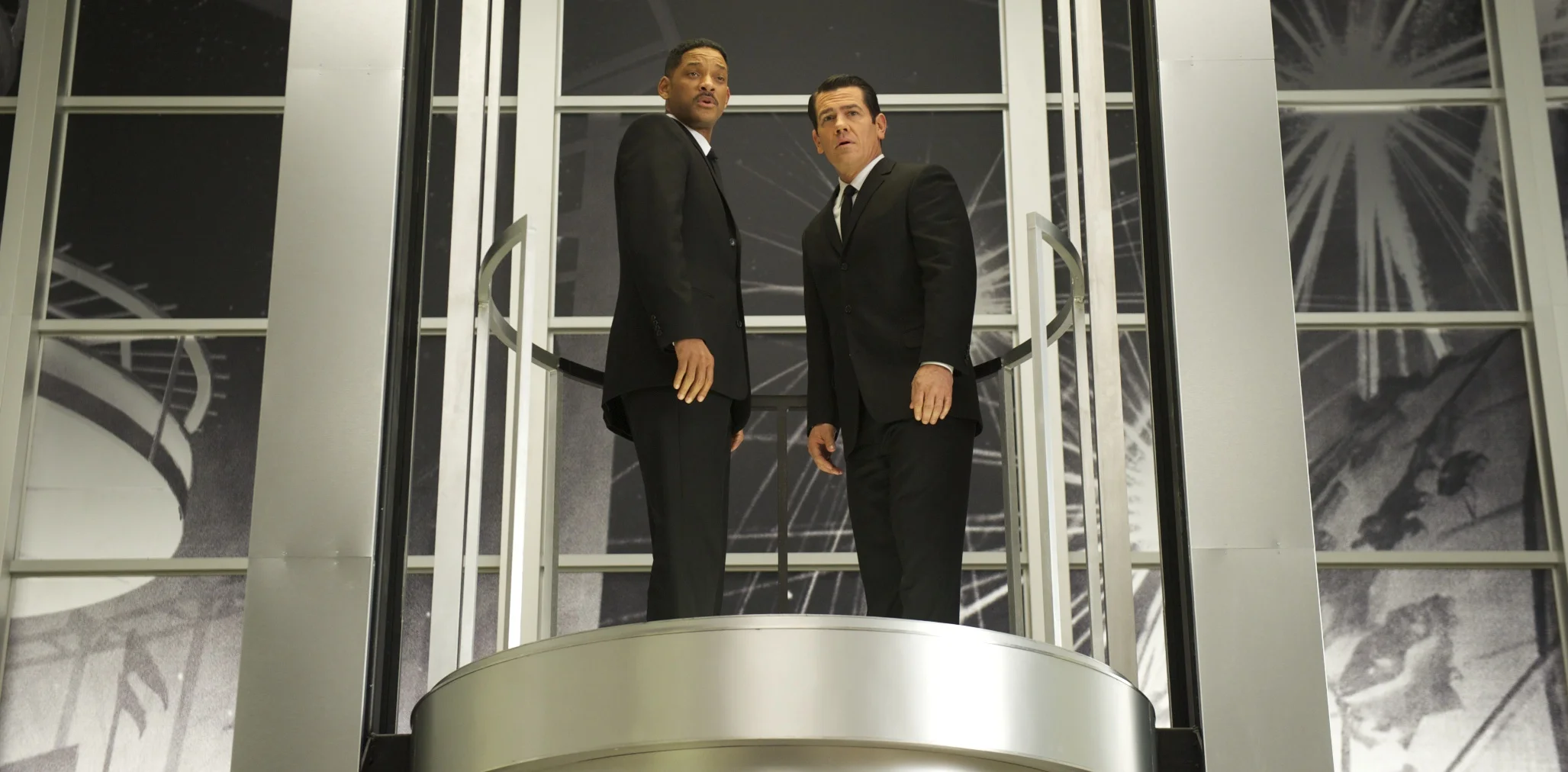 Will Smith as Agent J and Josh Brolin as Agent K talking a ride in Men in Black 3 (2012)