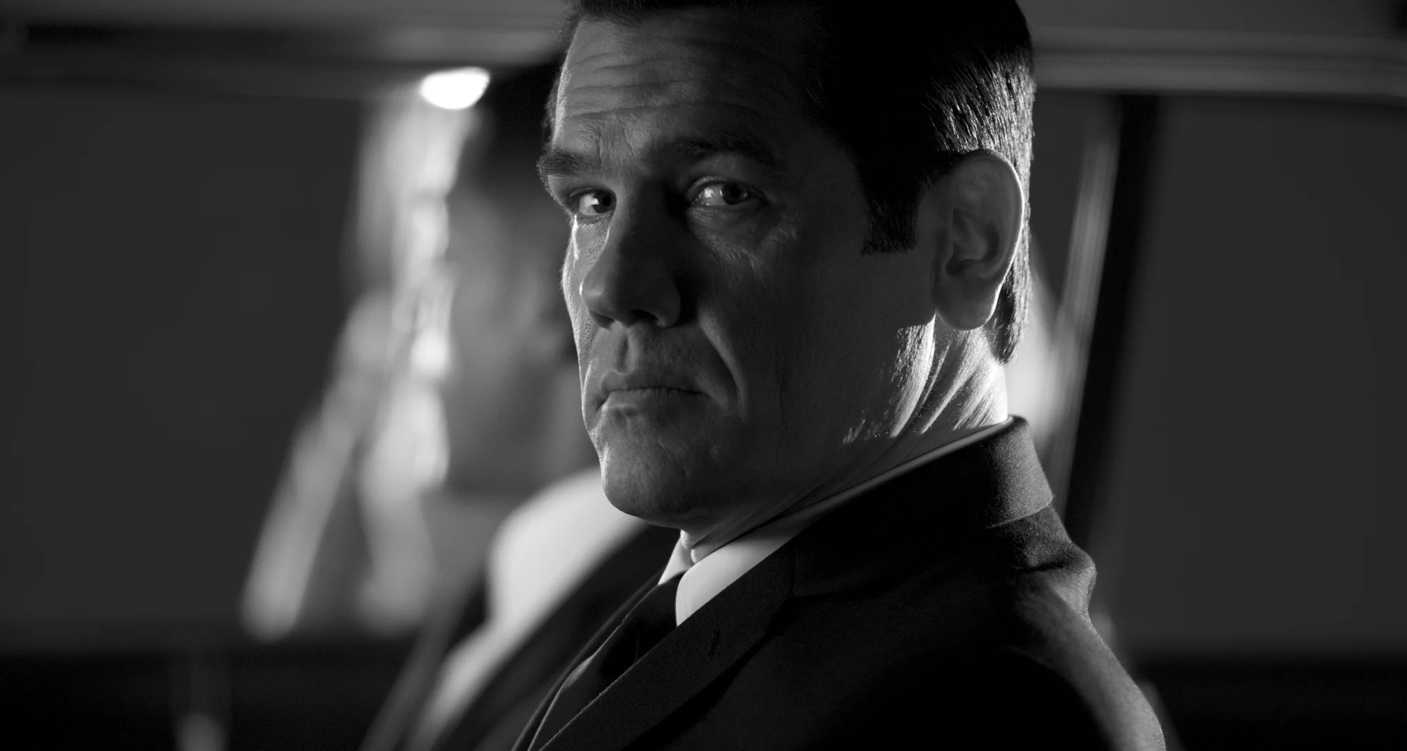 Josh Brolin as Agent K sitting outside of the bowling alley in Men in Black 3 (2012)