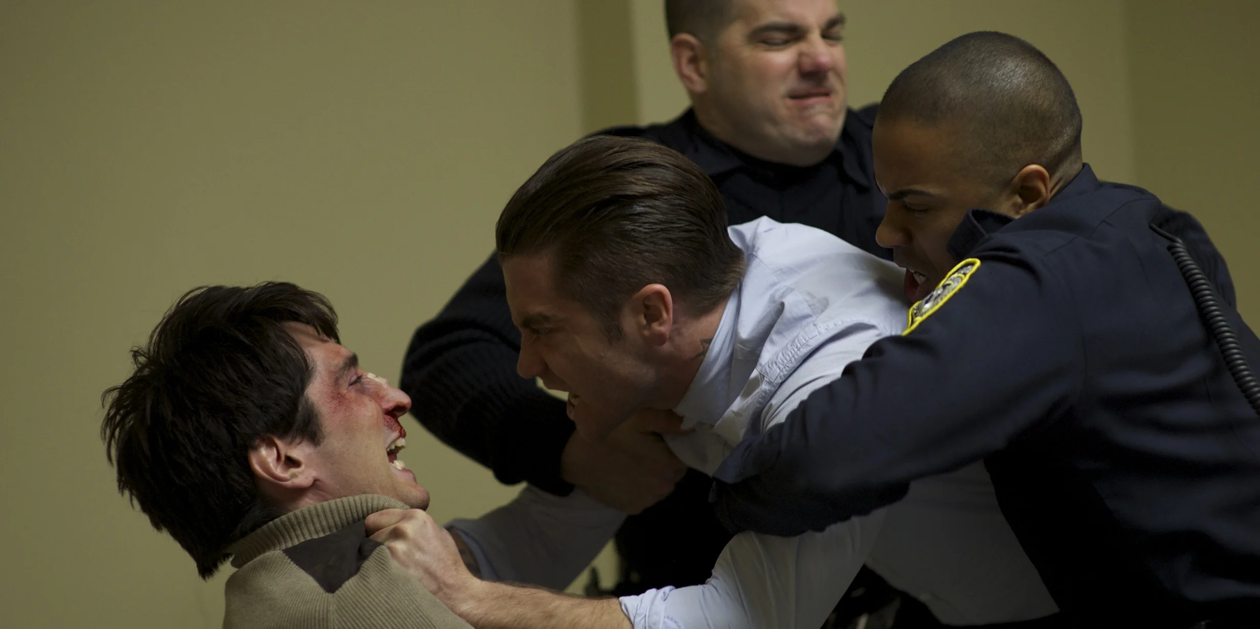 Jake Gyllenhaal as Detective Loki gets real with David Dastmalchian as Bob Taylor in Prisoners (2013)