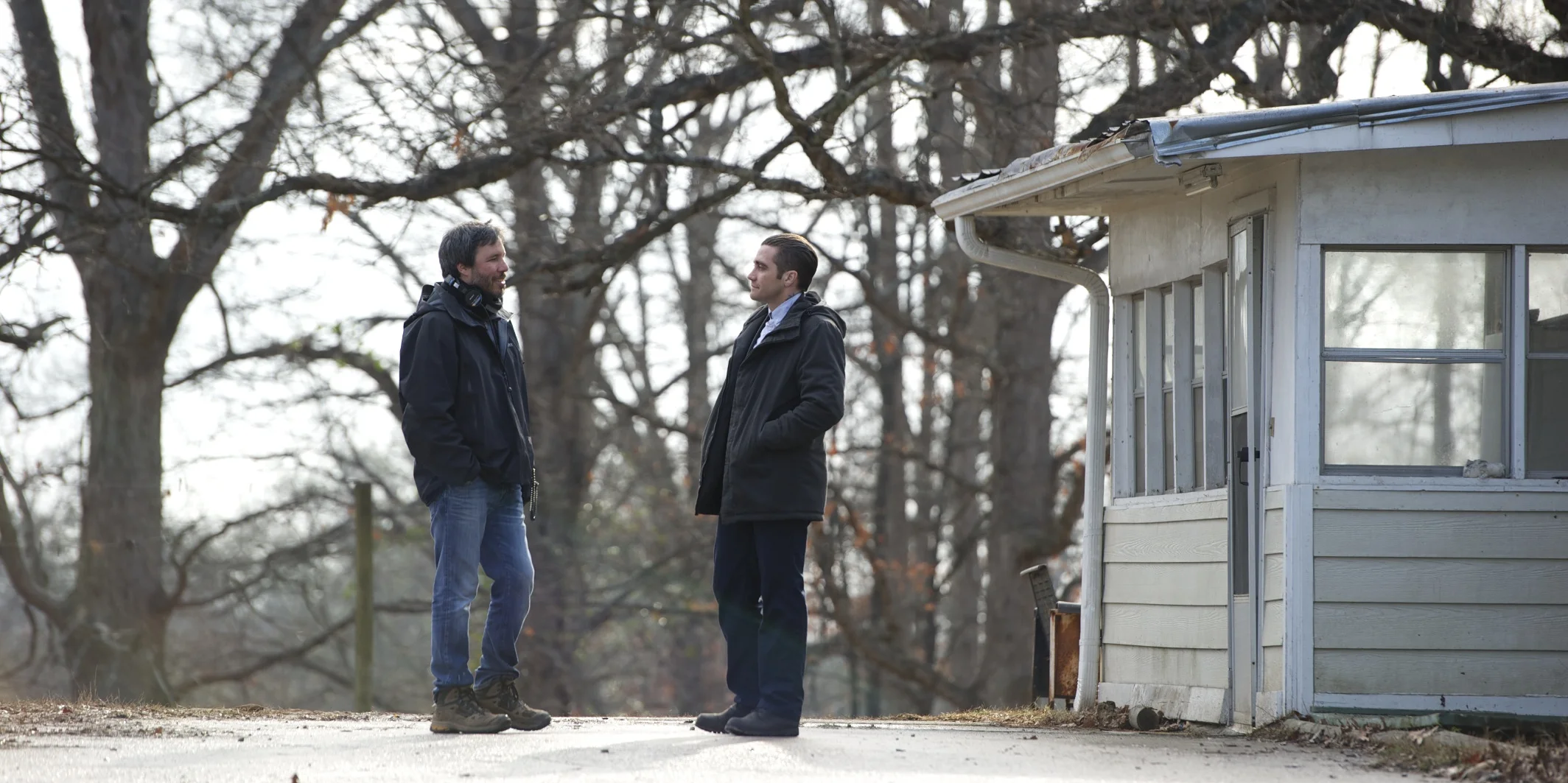 Director Denis Villeneuve and Jake Gyllenhaal on the set of Prisoners (2013)