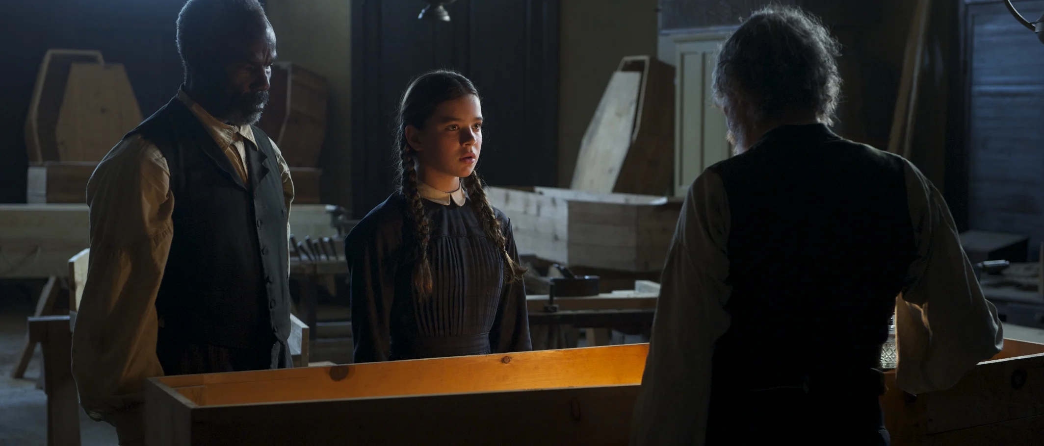 Roy Lee Jones as Yarnell and Hailee Steinfeld as Mattie Ross meeting the Undertaker in True Grit (2010)