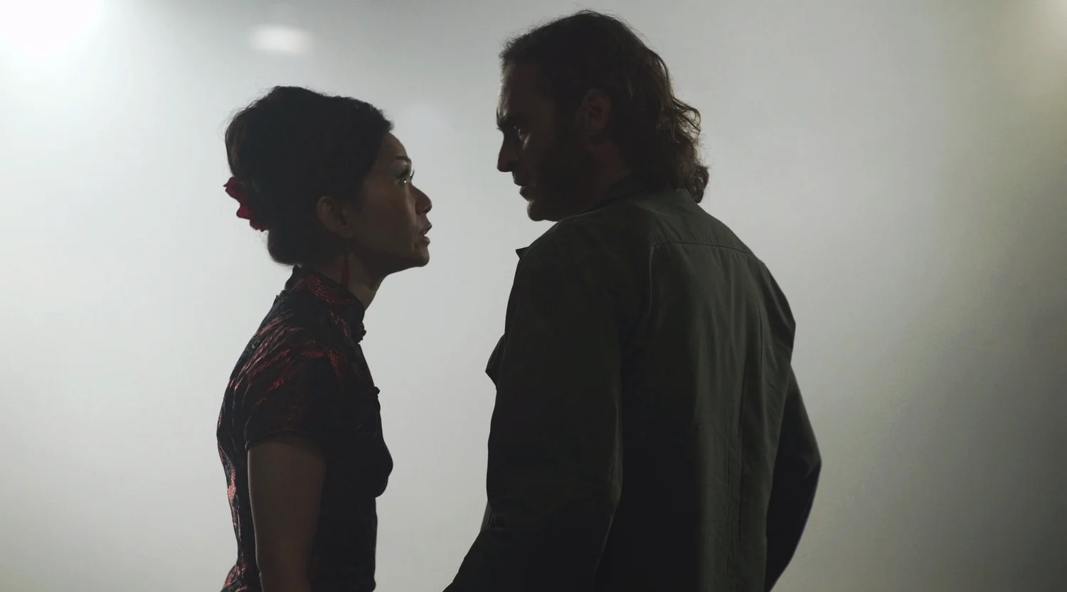 Hong Chau as Jade and Joaquin Phoenix as Larry "Doc" Sportello in Inherent Vice (2014)