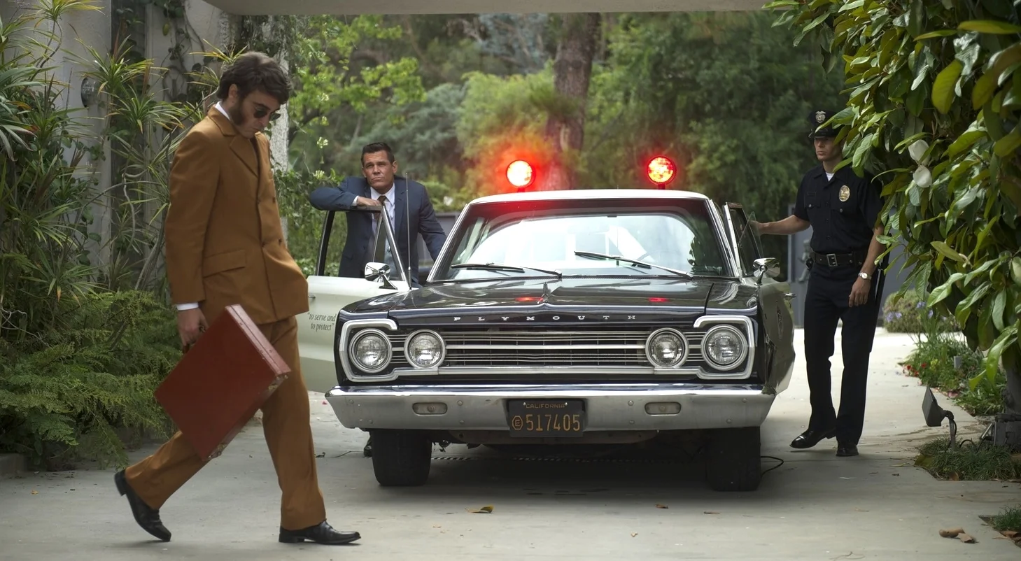 Joaquin Phoenix as Larry "Doc" Sportello and Josh Brolin as Bigfoot in Inherent Vice (2014)