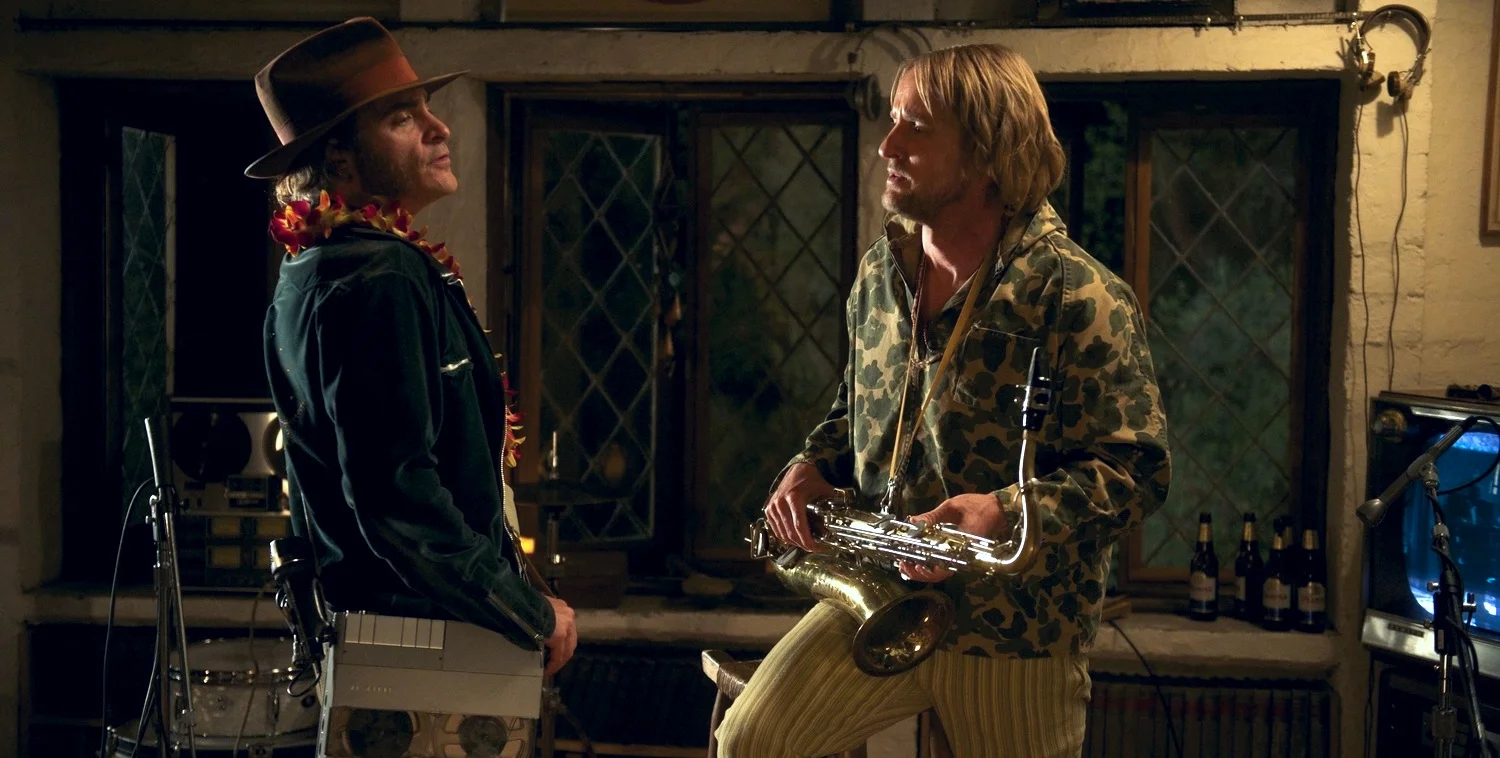Joaquin Phoenix plays Larry "Doc" Sportello and Owen Wilson as Coy Harlingen in Inherent Vice