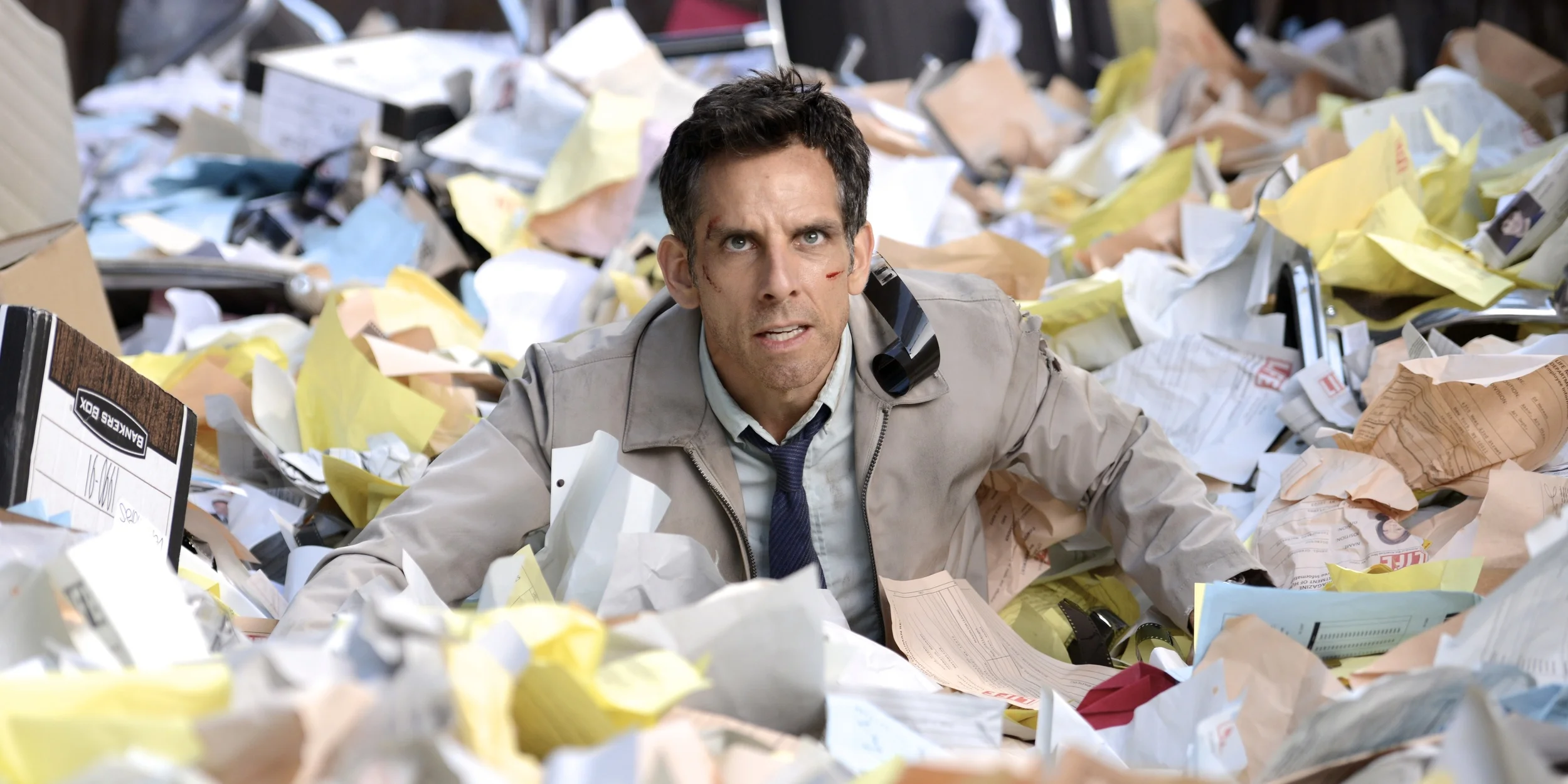 Ben Stiller as Walter Mitty in a dumpster during a scene in The Secret Life of Walter Mitty (2013)