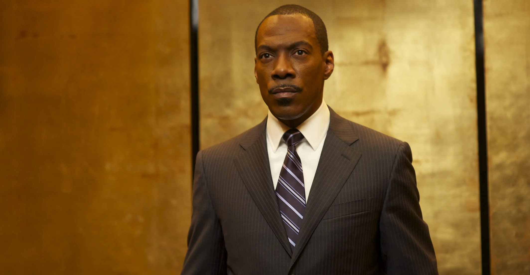 Eddie Murphy as Slide leaves the elevator in Tower Heist (2011)