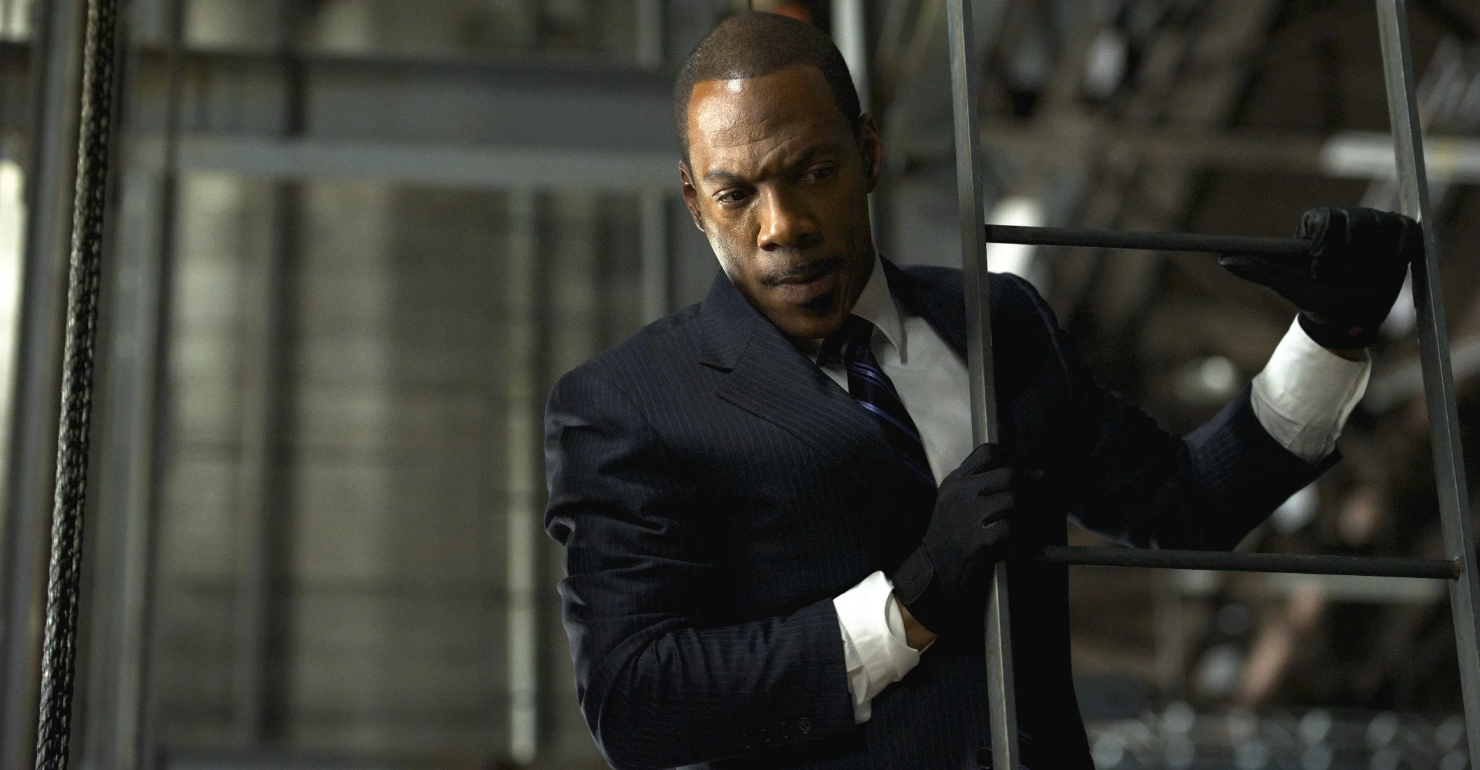 Eddie Murphy as Slide takes the short way down in Tower Heist (2011)