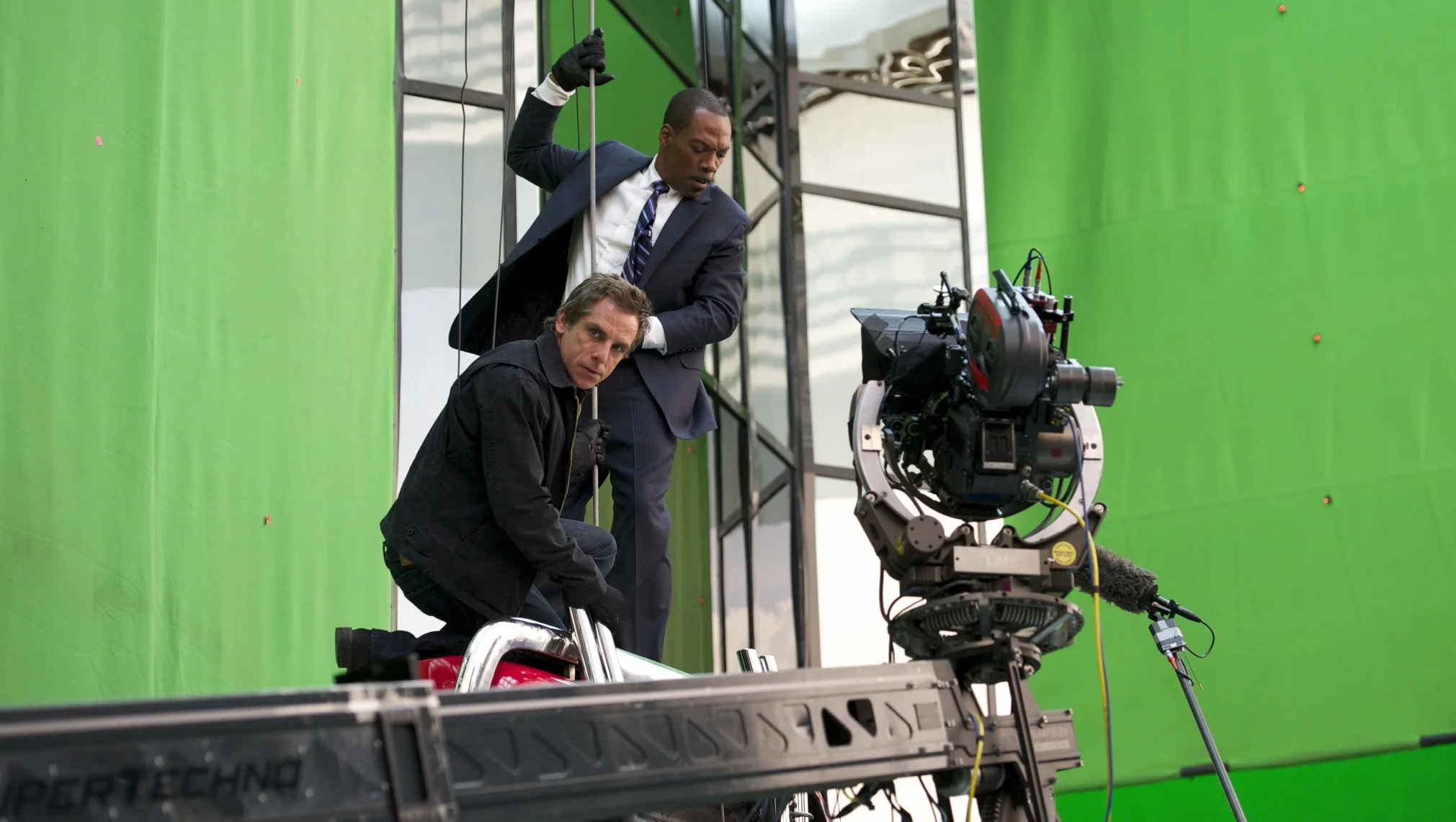Ben Stiller as Josh Kovacs and Eddie Murphy as Slide in front of the camera on Tower Heist (2011)