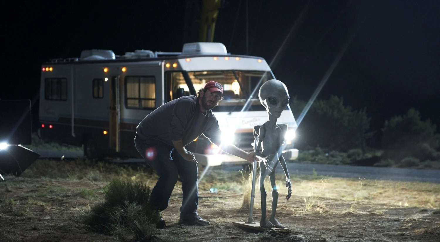 Director of Photography Lawrence Sher adjusts an Alien on the set of Paul (2011)