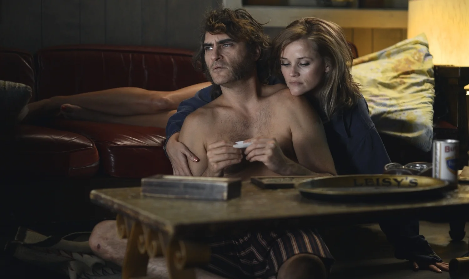 Joaquin Phoenix as Larry "Doc" Sportello and Reese Witherspoon as Deputy D.A. Penny Kimball in Inherent Vice (2014)