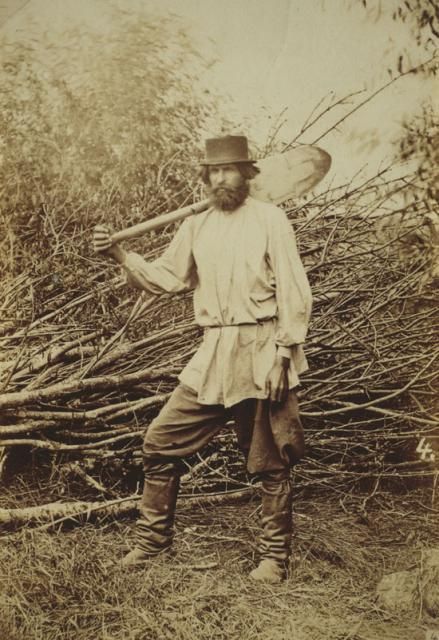 19th Century Russian serf posing with spade.