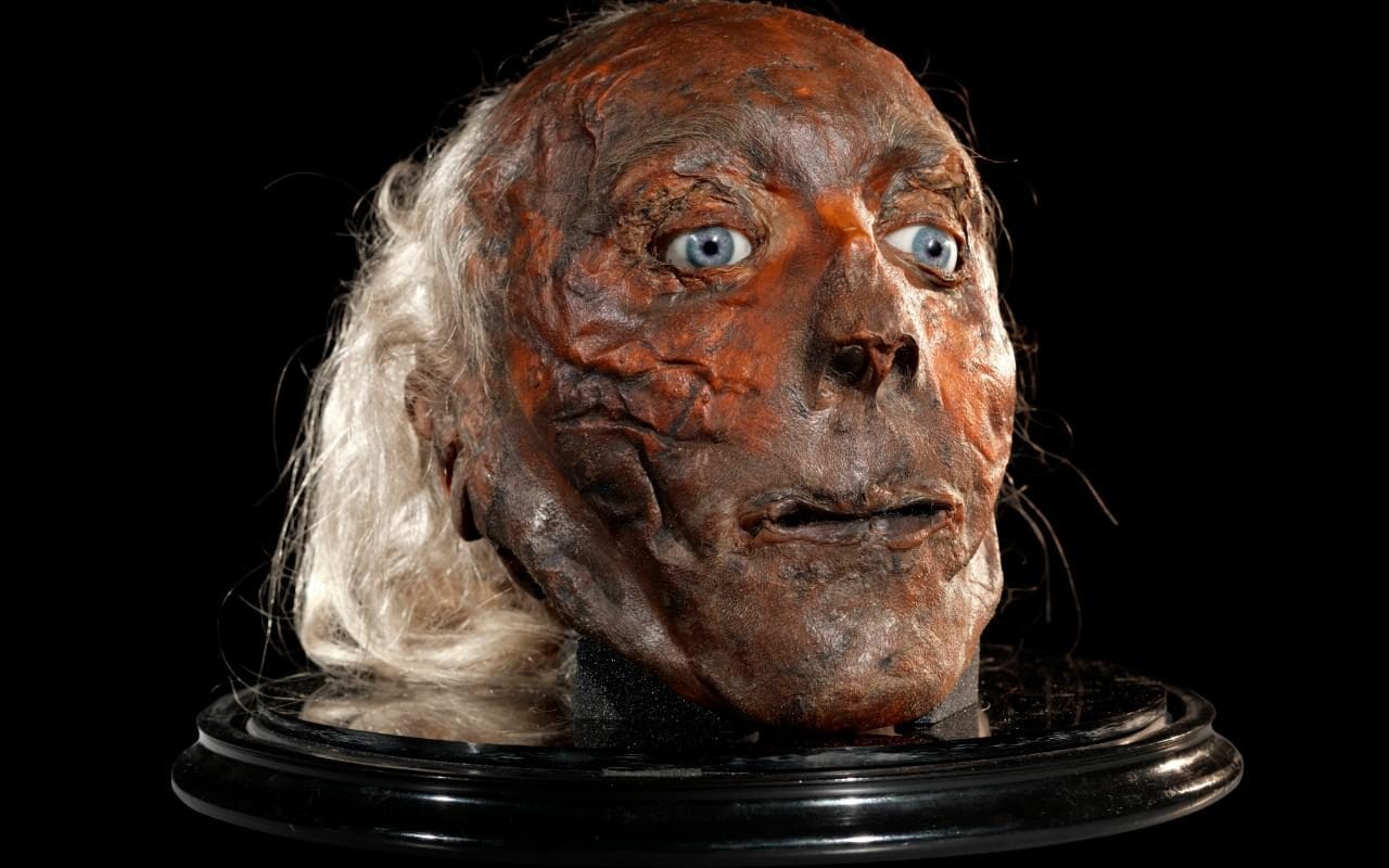 Jeremy Bentham’s taxidermied head adordned with his coveted glass eyeballs.