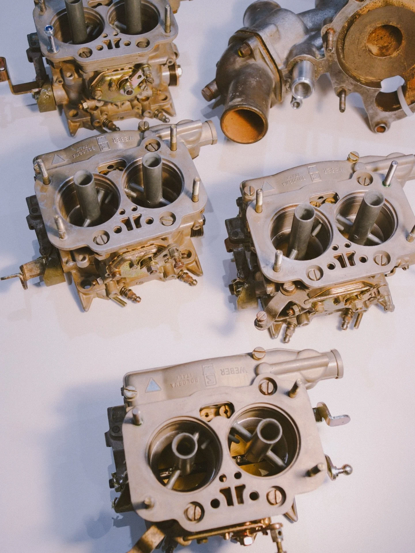 Progress is looking good on the Ferrari 308 GT4 Dino, and we&rsquo;re hoping to have it back on the road for Christmas. 🎄🔥
A satisfying little joint venture on this one &mdash; all four Weber 40 DCNF carburettors have now been fully overhauled and 