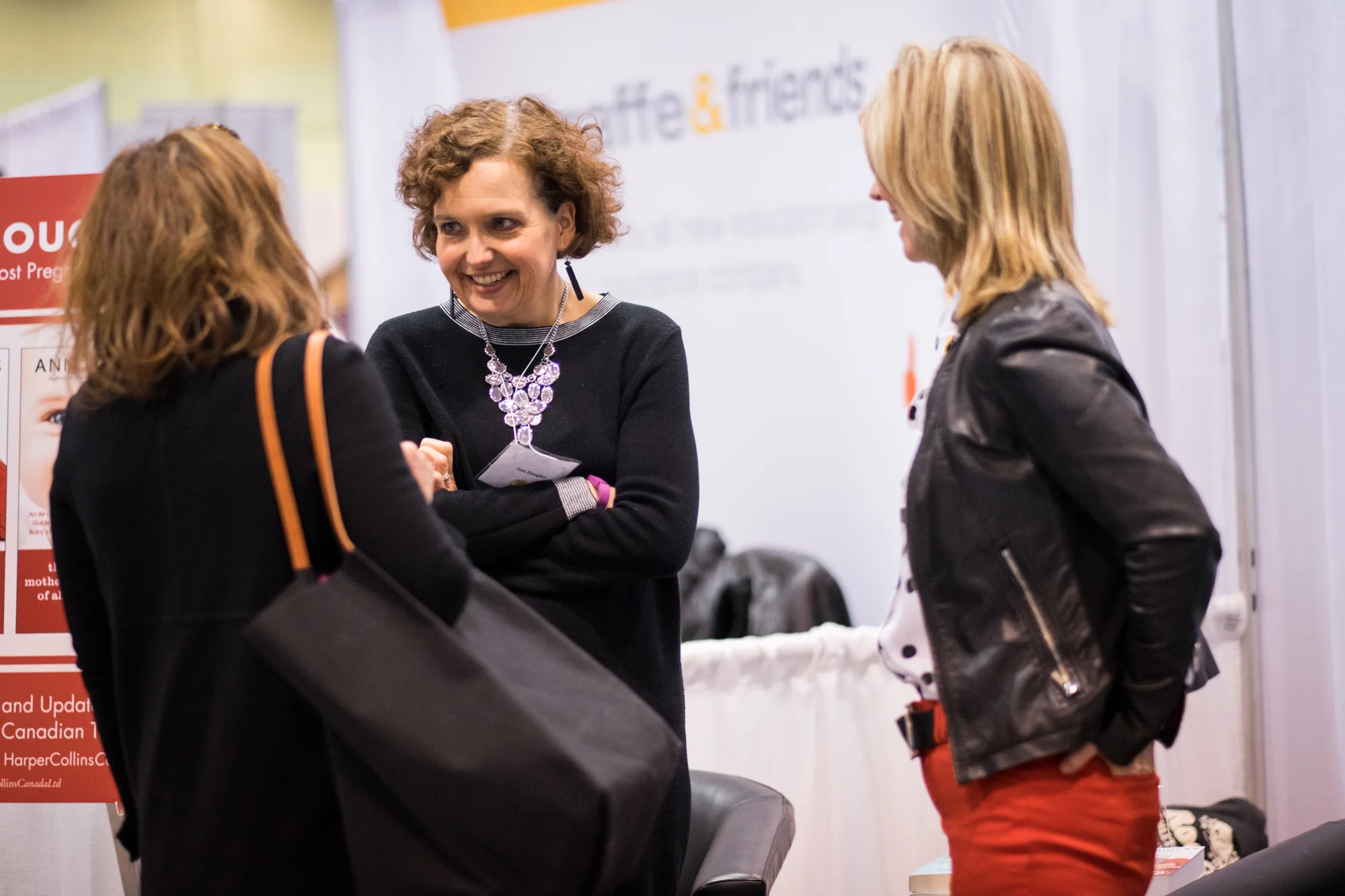 Ann Douglas chats with a parent at The Baby Show, Toronto.
