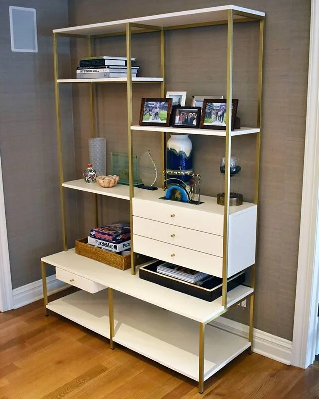 A large brass and lacquer shelving unit from some time ago for a great client. This piece was an interesting challenge from a design and construction standpoint. The solid brass frame used machined mechanical joints, integrated leveling feet, and cou