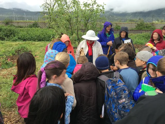 Fourth-graders attend the unveiling of the panels